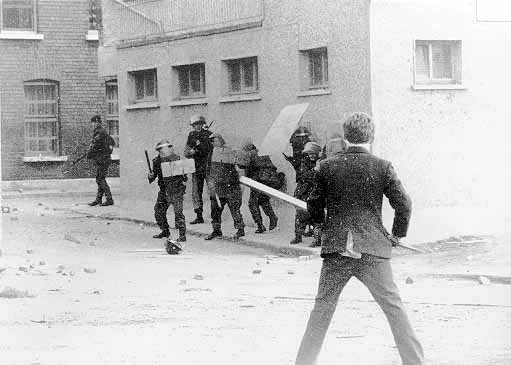 A local youth confronts soldiers in riot gear, Abbey Street, June 1971